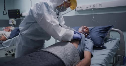 Medical Worker Attending to Hospital Patient