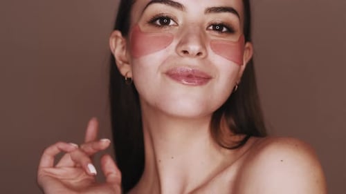Young Woman Posing With Eye Masks On