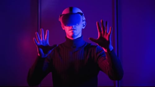 Man Using Virtual Reality Headset With Hand Gestures