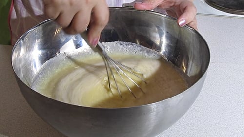 Close-up Mixing Baking Ingredients in Bowl with Whisk