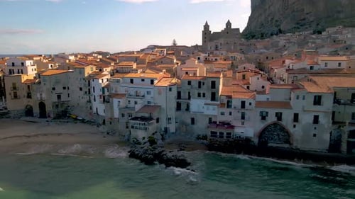Cefalu Sicily Sunset at the Beach of Cefalu Sicilia Italy Mid Age Men and Woman on Vacation Sicily