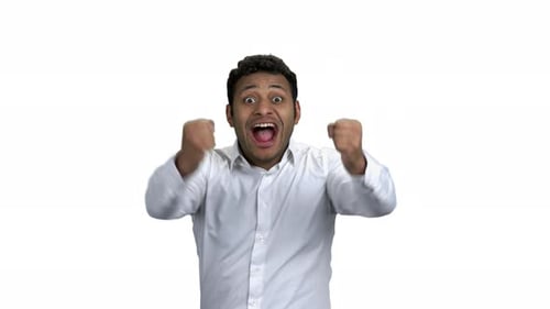 Man Celebrating with Pumping Fists on White Background