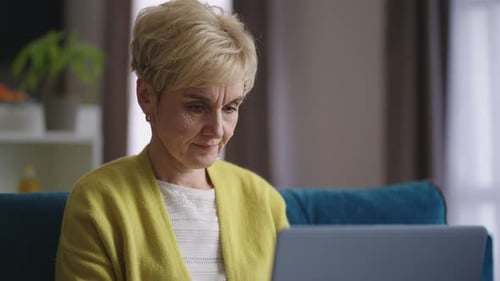 Woman Using Laptop Computer Indoors