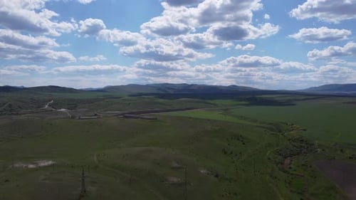 Boundless Green Meadows Against the Misty Sky