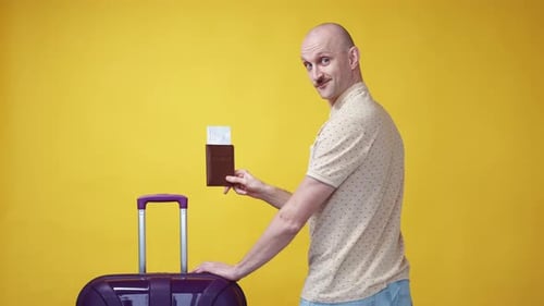 Excited Man Holding Passport Near Suitcase