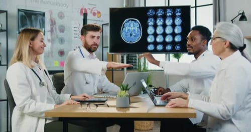 Doctors Collaborate Successfully in Modern Workplace Setting