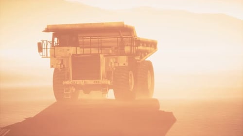 Massive Mining Dump Truck in Dusty Desert Landscape