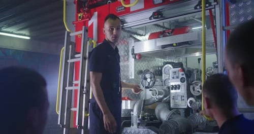 Firefighter Teaching Trainees on Station