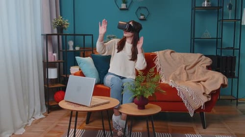 Young Woman Using VR Headset at Home