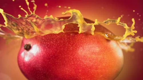 Juice Splashing Over a Delicious Red Mango