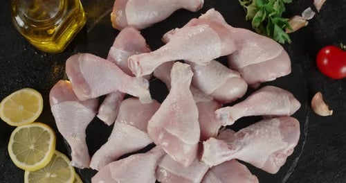 Raw Chicken Legs with Fresh Food Ingredients