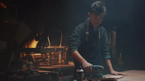 Cinematic Video of a Carpenter at Work in a Carpentry Workshop