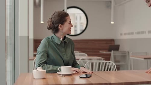 Man and Woman Meeting in Cafe