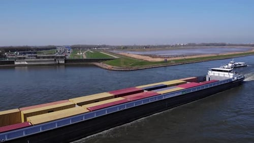 Ship Carrying Intermodal Containers In River Noord, Netherlands. drone ascend