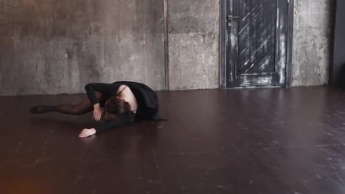 Woman Dancing Ballet in an Industrial Room