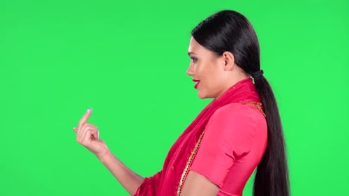 Glamorous Woman Posing in Pink Dress on Greenscreen Glamorous Woman Posing in Pink Dress on Greenscreen