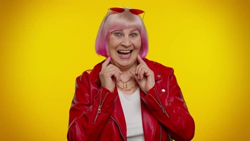 Stylish Senior Woman with Pink Hair Smiling