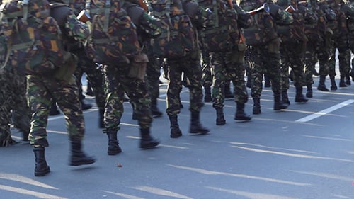 Soldiers Marching in Camouflage in an Urban Parade