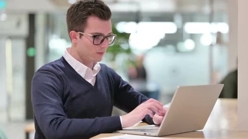 Young Adult Working at Laptop Says No