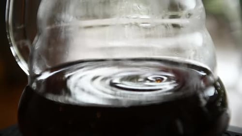 Brewed Coffee Dripping Into Glass Carafe