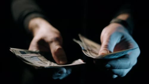 Close up of hands counting money