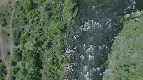 Aerial View of a Turbulent Stream Scattered with Large Rocks