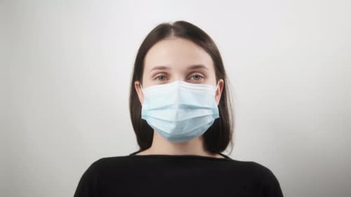 Happy Positive Girl Young Beautiful Woman Takes Off Protective Medical Mask From Face Smiling