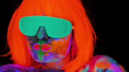 Woman Covered in Neon Paint with Orange Hair