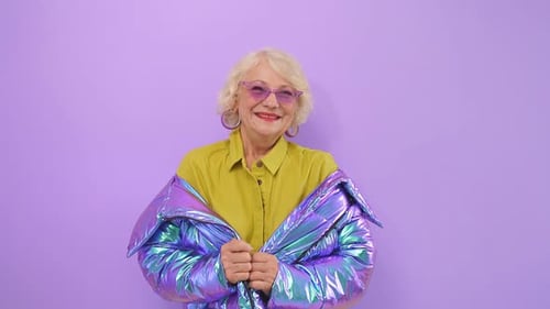 Cute, Positive Old Lady Smiling Posing in the Studio on an Isolated Background