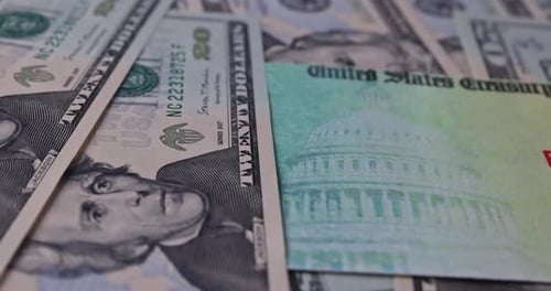 Macro Shot of Twenty Dollar Bills and Stimulus Checks