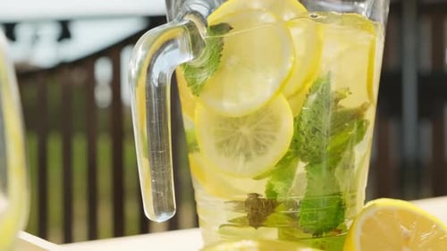 Fresh Lemonade with Lemons and Spearmint Leaves
