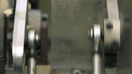 Industrial Machine Parts Moving in Close Up