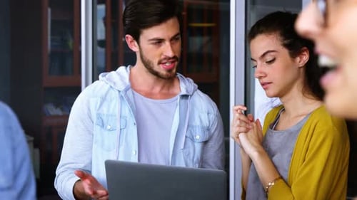 Young Adults Working Together in Modern Office