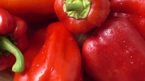 Close-Up of Fresh Red Bell Peppers with Water Droplets