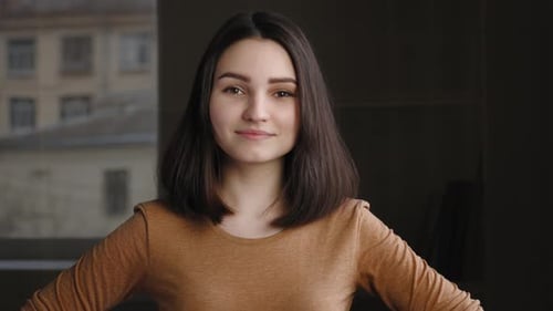 Portrait of Beautiful Young Attractive Brunette Girl Looking at Camera Nods Shaking Her Head