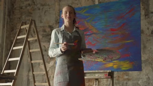 Young Adult Woman Standing in Art Studio