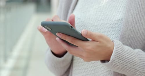 Woman Using Mobile Phone in Urban Setting