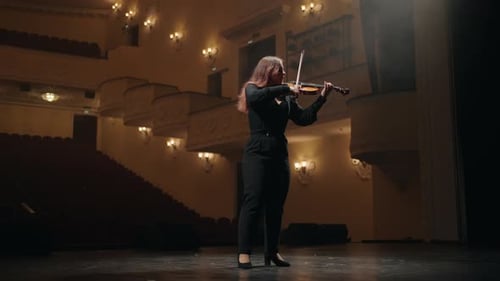 Lonely Young Female Violinist is Playing Fiddle in Music Hall Fulllength Portrait of Musician