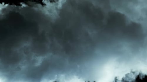 Moody Clouds Billowing Against Black Background