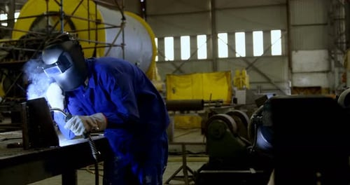Male Engineer Using Welding Torch
