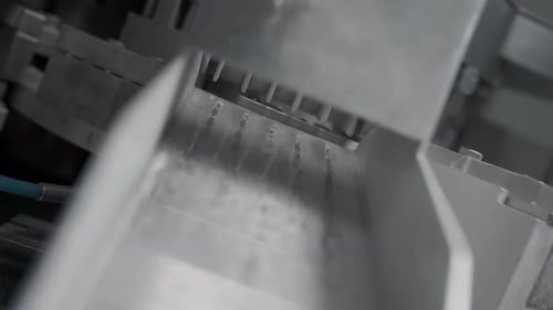 Manufactured Drug Capsules Fall Out of an Automatic Machine or Medical Equipment