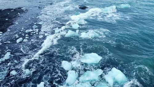 Iceberg in the Ocean Huge Chunks of Blue Ice Floating on the Waves Arctic Landscape Aerial View