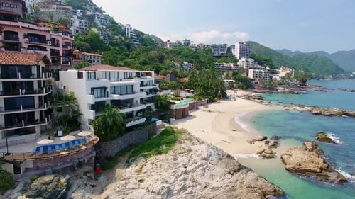 Tropical Beachfront Condominiums Overlooking Calm Waters