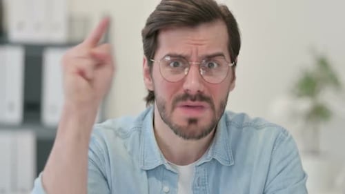 Upset Man Shaking Finger Indoors Close Up