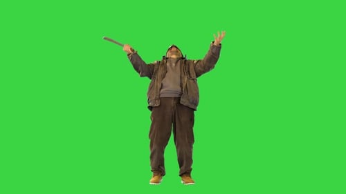 Masked Man with Machete Stands on Green Screen
