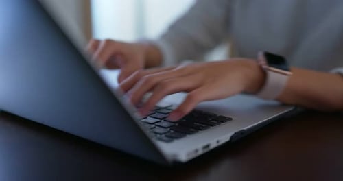 Woman Typing on Laptop Keyboard Close Up