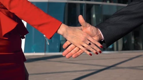 Business Handshake at Modern Glass Office Building