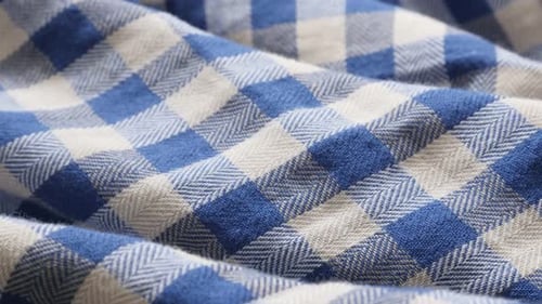 Blue and white shirt check pattern fabric texture close-up slow tilt 4K 2160p 30fps UHD footage - Ch