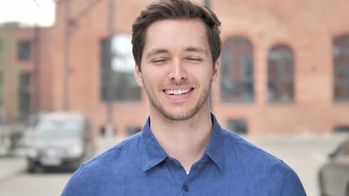 Smiling Man in Blue Shirt Close Up