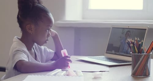 Girl Doing Arts and Crafts Watching Online Teacher